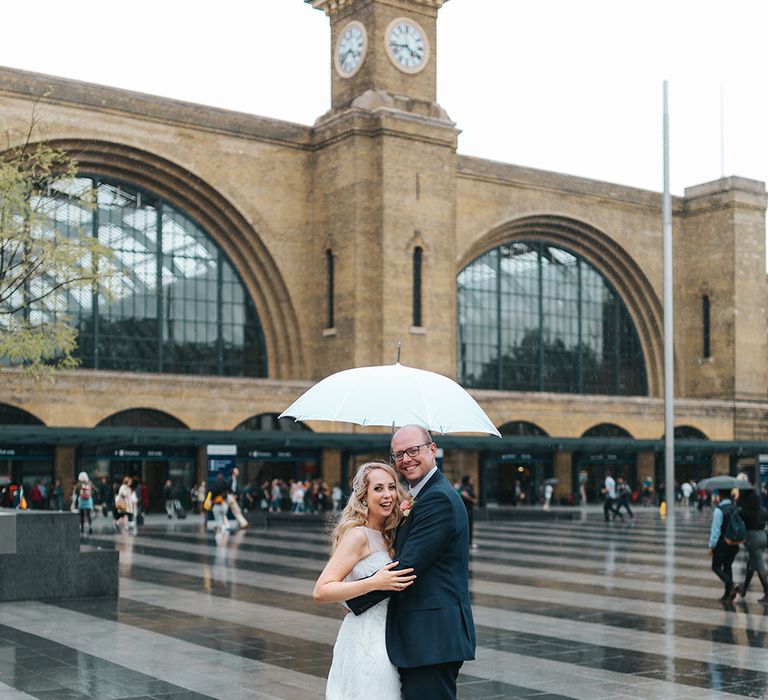 Bride in Rosa Clara Veleta Wedding Dress & Groom in Chester Barrie Suit