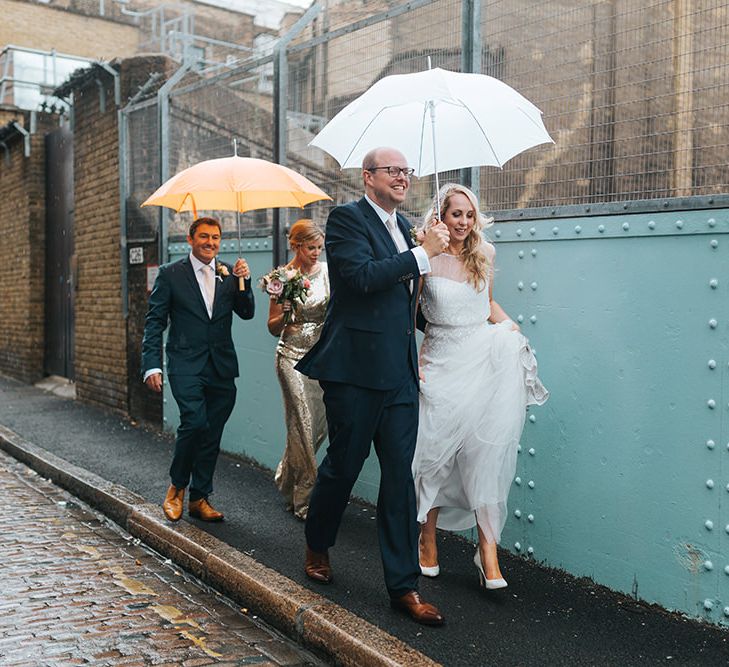 Bride in Rosa Clara Veleta Wedding Dress & Groom in Chester Barrie Suit