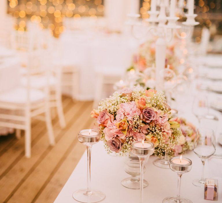 White Candelabra & Blush Pink Flower Wedding Reception with Fairy Light Backdrop