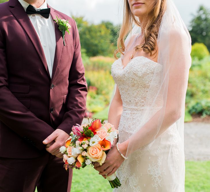 Bride in Lace Sweetheart Neckline Dress | Groom in Burgundy Suit | Kathy Silke Photography