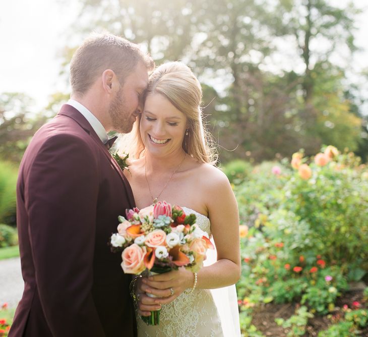 Bride in Lace Sweetheart Neckline Dress | Groom in Burgundy Suit | Kathy Silke Photography