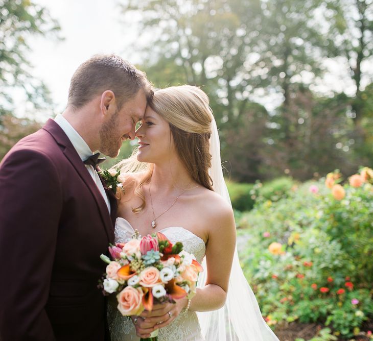 Bride in Lace Sweetheart Neckline Dress | Groom in Burgundy Suit | Kathy Silke Photography