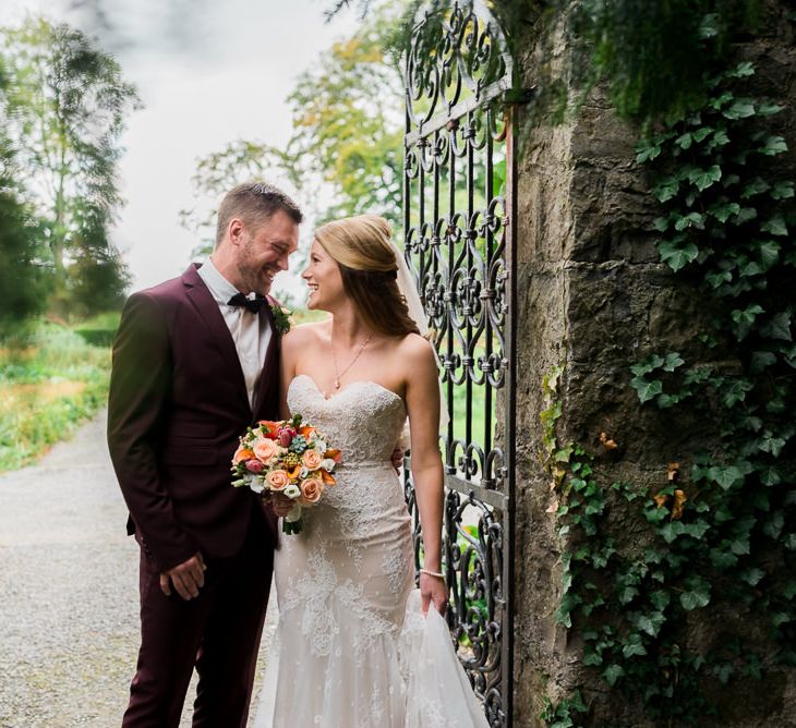 Bride in Lace Sweetheart Neckline Dress | Groom in Burgundy Suit | Kathy Silke Photography