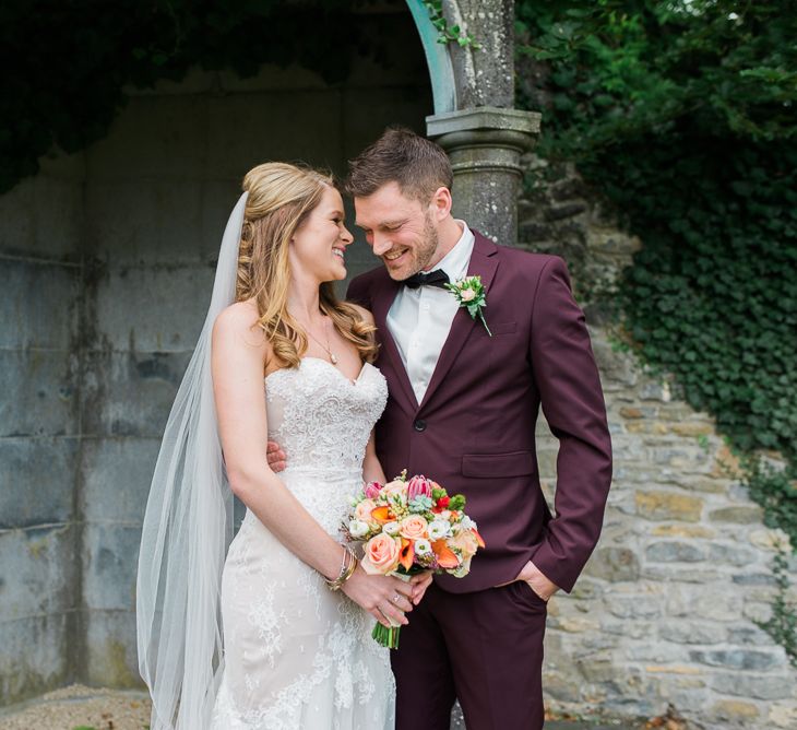 Bride in Lace Sweetheart Neckline Dress | Groom in Burgundy Suit | Kathy Silke Photography