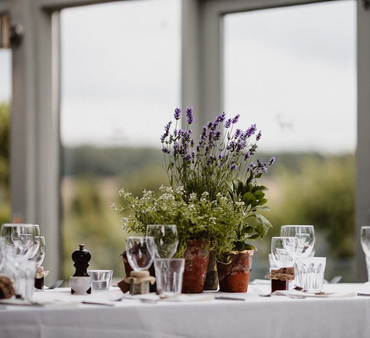 Wild Flower Plant Pot Centrepieces | Lilac & Navy Rustic Wedding at Stone Barn, Cotswolds | Frankee Victoria Photography