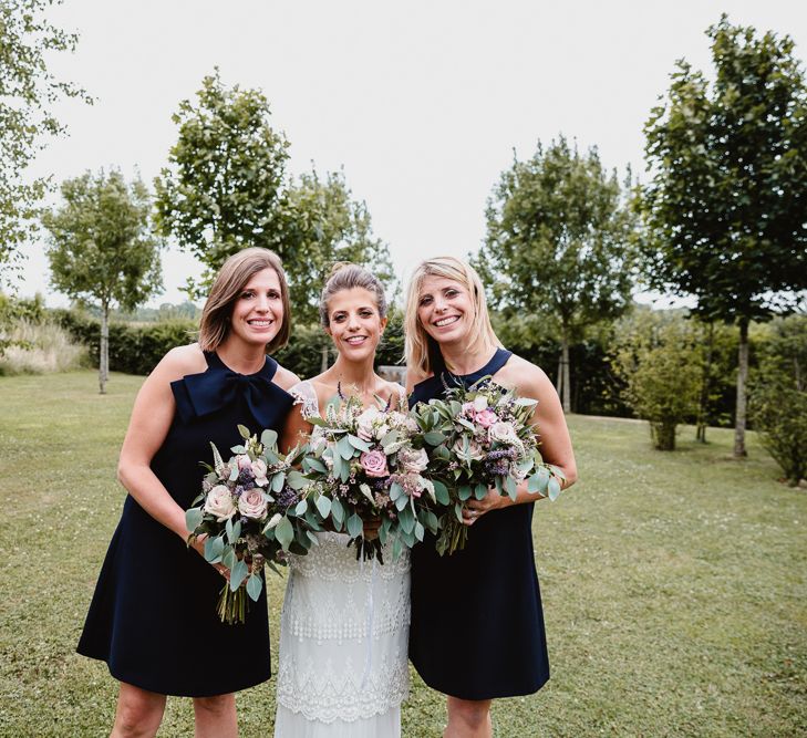 Bride in Claire Pettibone Bridal Gown | Bridesmaids in Navy Dresses | Lilac & Navy Rustic Wedding at Stone Barn, Cotswolds | Frankee Victoria Photography