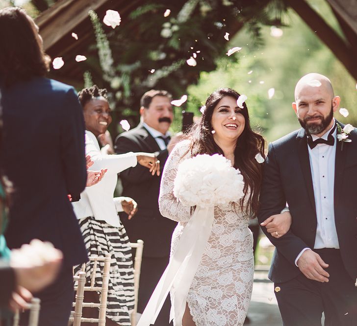 Confetti Moment | Bride in Grace Loves Lace Wedding Dress | Groom in Tuxedo | Lemonade Pictures