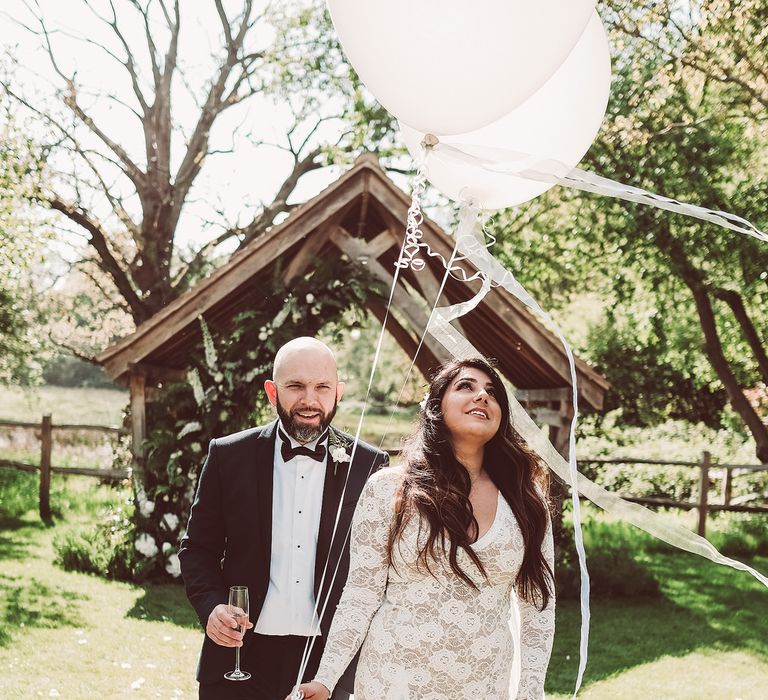 Bride in Grace Loves Lace Wedding Dress | Groom in Tuxedo | Giant Balloons | Lemonade Pictures