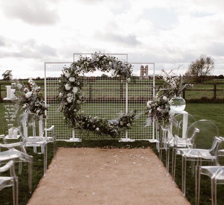 Aisle & Altar Style | Moon Gate Floral Arch by Swaffham Florist | Ghost Chairs | Nocturn Wedding Inspiration Planned & Styled by The Little Lending Company | Agnes Black Photography | Film by The Wilde Bride