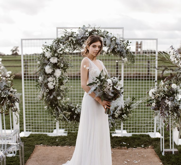 Bride in Watters Wtoo Bridal Gown | Aisle & Altar Style | Moon Gate Floral Arch by Swaffham Florist | Ghost Chairs | Nocturn Wedding Inspiration Planned & Styled by The Little Lending Company | Agnes Black Photography | Film by The Wilde Bride