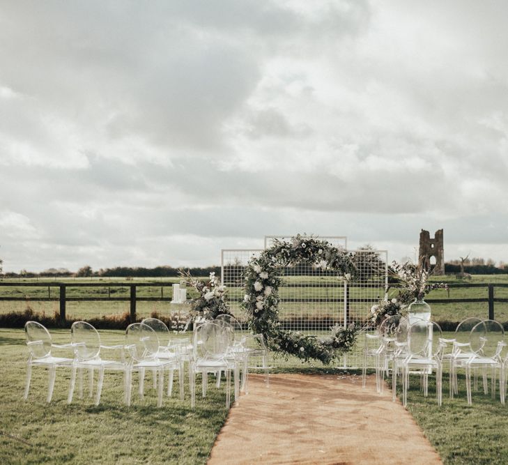 Moon Gate Altar | Ghost Chairs | Perspex Pew Ends | Nocturn Wedding Inspiration Planned & Styled by The Little Lending Company | Florals by Swaffham Florist | Photography & Film by The Wilde Bride