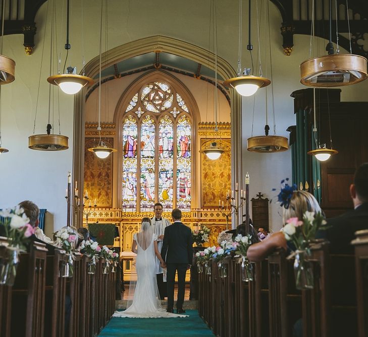 Church Wedding Ceremony with Aisle Flowers & Hanging Lights