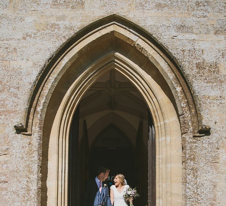 Bride in Pronovias Irune Gown & Groom in Hugo Boss Suit