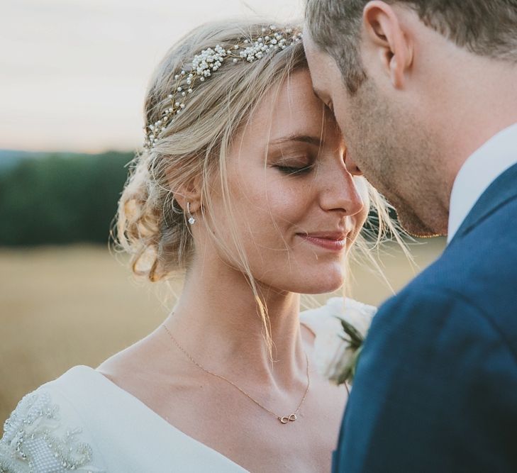 Bride & Groom Embrace | Gillian Millon Hair Vine