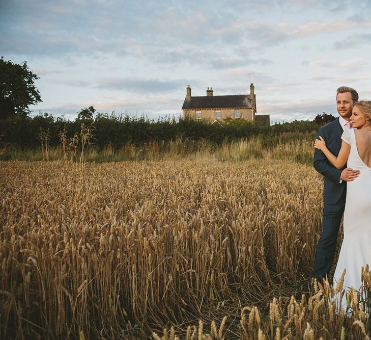 Bride in Pronovias Irune Gown & Groom in Hugo Boss Suit