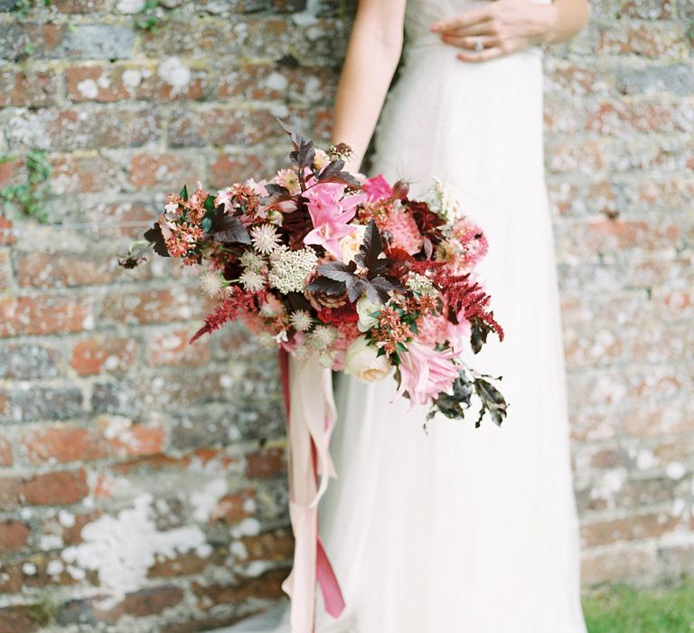 Red & Pink Bridal Bouquet by Martha & the Meadow | Naomi Neoh Bridal Gowns | Opulent Wedding Inspiration at Warmwell House in Dorset with Rich colour Palette Planned by Kelly Chandler | Imogen Xiana Photography | Gorgeous Films