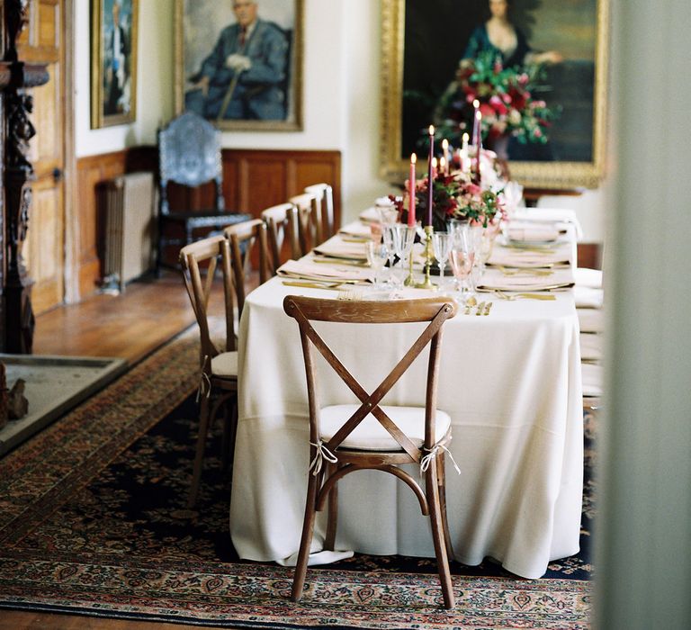 Rich Table Scape Decor with Taper Candles, Floral Centrepieces & Gold Cutlery | Opulent Wedding Inspiration at Warmwell House in Dorset with Rich colour Palette Planned by Kelly Chandler | Imogen Xiana Photography | Gorgeous Films