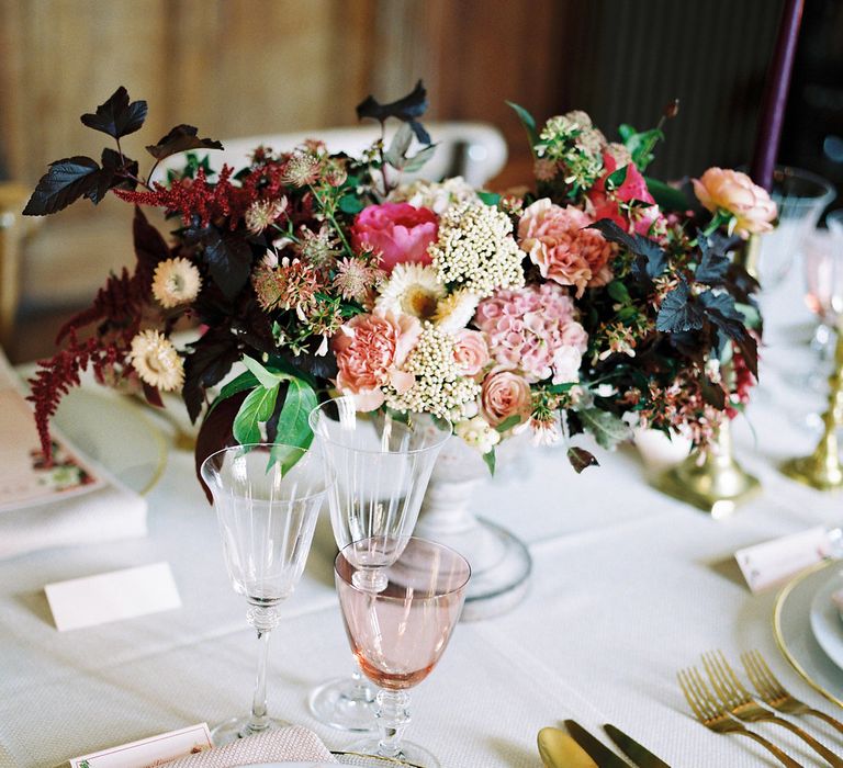 Rich Place Setting Decor with Taper Candles, Floral Centrepieces & Gold Cutlery | Opulent Wedding Inspiration at Warmwell House in Dorset with Rich colour Palette Planned by Kelly Chandler | Imogen Xiana Photography | Gorgeous Films