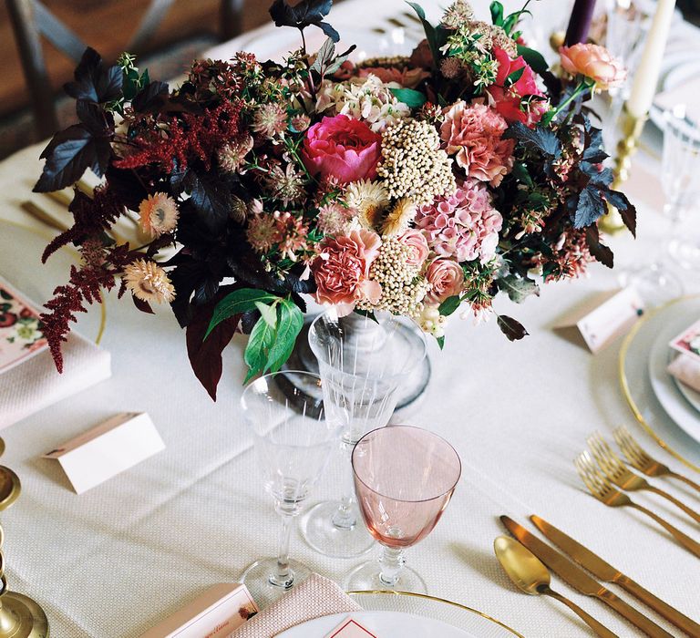 Rich Table Scape Decor with Taper Candles, Floral Centrepieces & Gold Cutlery | Opulent Wedding Inspiration at Warmwell House in Dorset with Rich colour Palette Planned by Kelly Chandler | Imogen Xiana Photography | Gorgeous Films