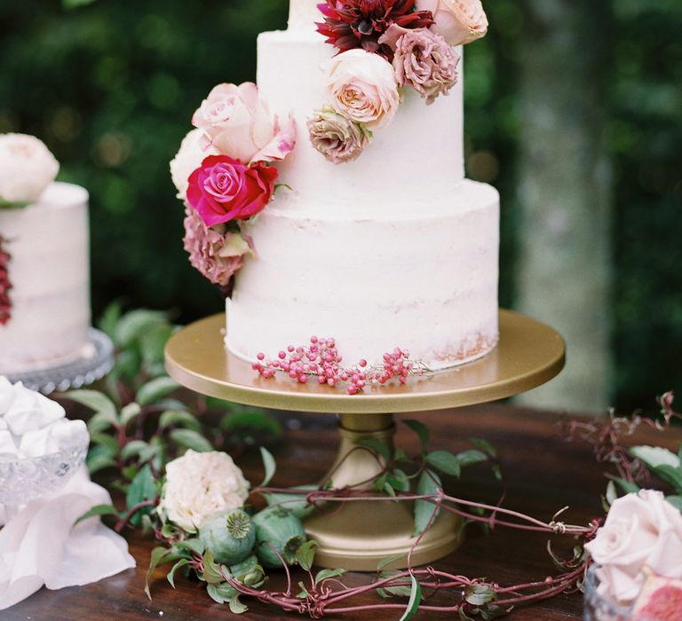 Iced Wedding Cake with Floral Decor by France Buns | Opulent Wedding Inspiration at Warmwell House in Dorset with Rich colour Palette Planned by Kelly Chandler | Imogen Xiana Photography | Gorgeous Films