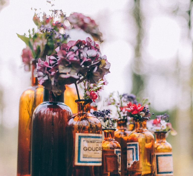 Glass Bottles & Flowers Wedding Decor