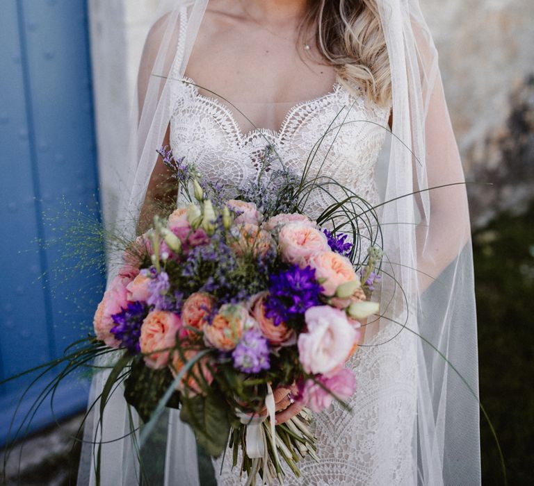 Bride In Watters With Pink & Plum Toned Wedding Bouquet