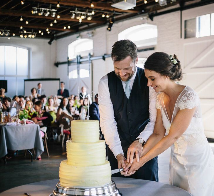 Cutting The Cake // Trinity Buoy Wharf Wedding With Bride In Otaduy And Planning By Liz Linkleter Events Flowers By Grace And Thorn Images From My Beautiful Bride Photography