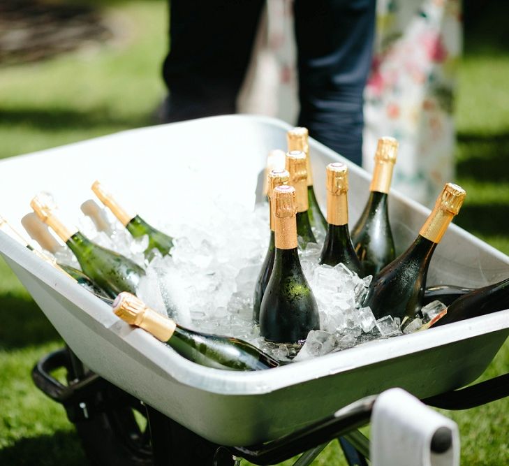 Champagne Bottles in Wheel Barrow | Outdoor Wedding at Chateau Rigaud in France | Real Simple Photography | Yellow Gazelle Film