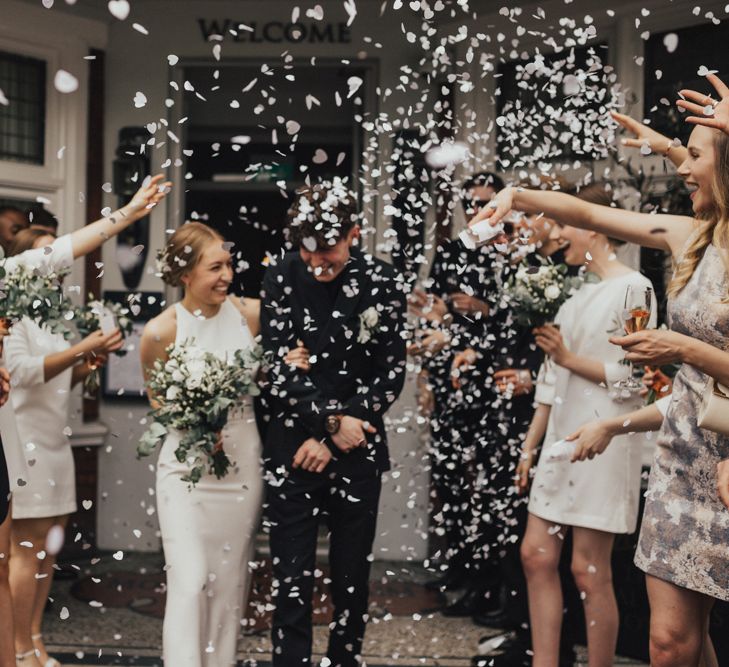 Bride In Sarah Seven Dress & Groom In All Black With Bridesmaids In White Shift Dresses And Foliage Decor With Images By Nataly J Photography