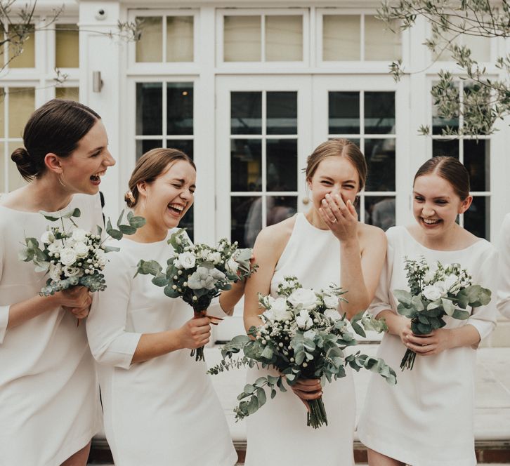 Bride In Sarah Seven Dress & Groom In All Black With Bridesmaids In White Shift Dresses And Foliage Decor With Images By Nataly J Photography