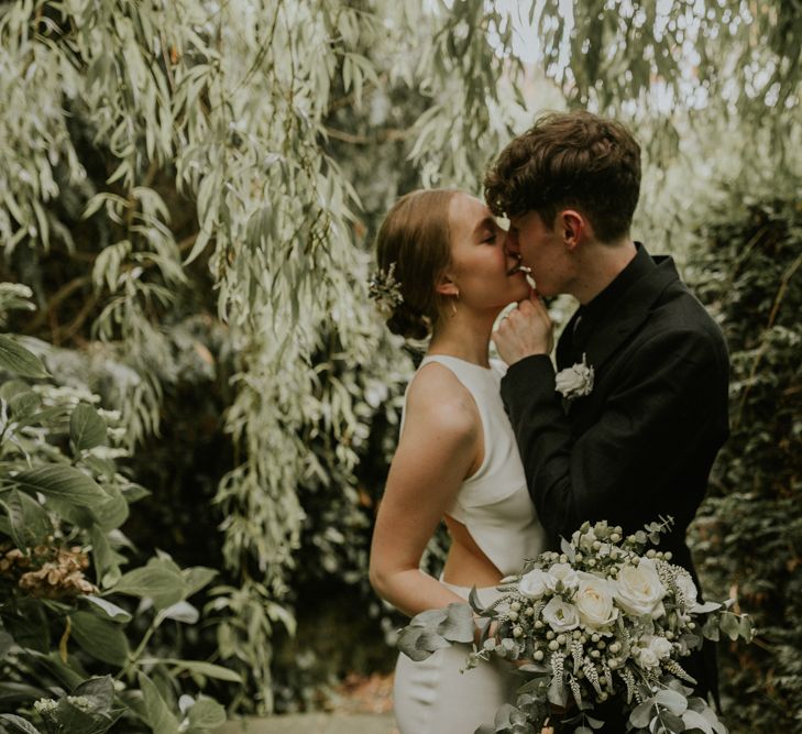 Bride In Sarah Seven Dress & Groom In All Black With Bridesmaids In White Shift Dresses And Foliage Decor With Images By Nataly J Photography