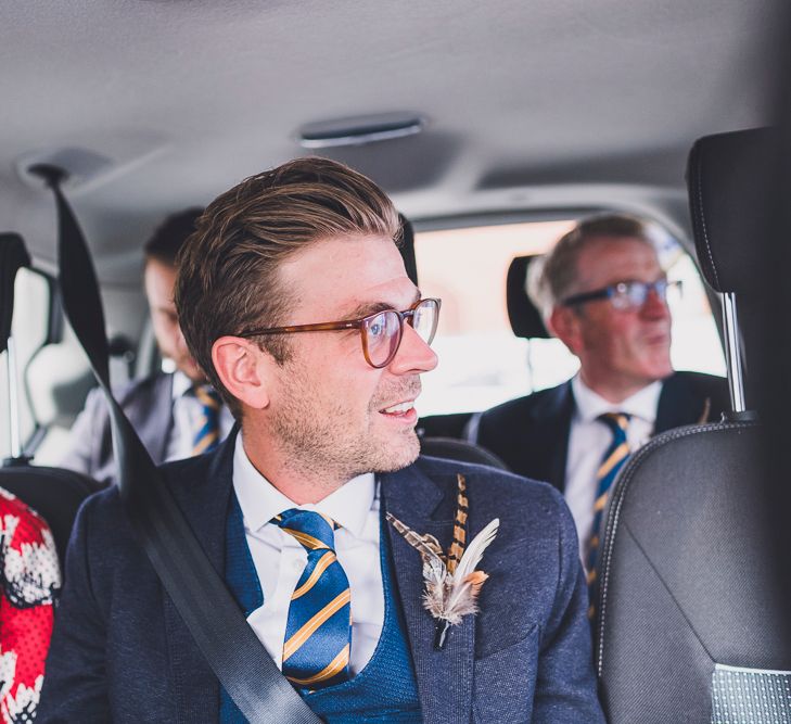 Groom with Feather Buttonhole