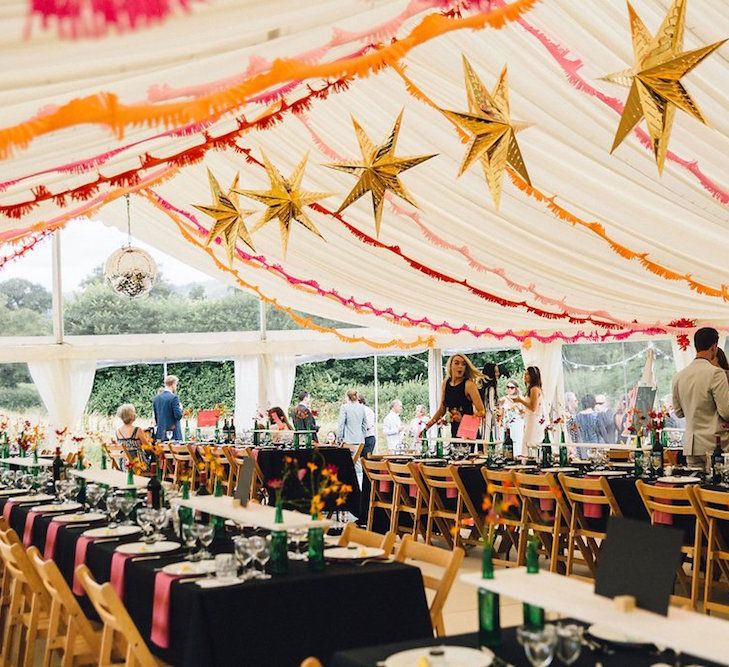 Marquee Wedding With Star Lanterns and With Black And Orange Decor