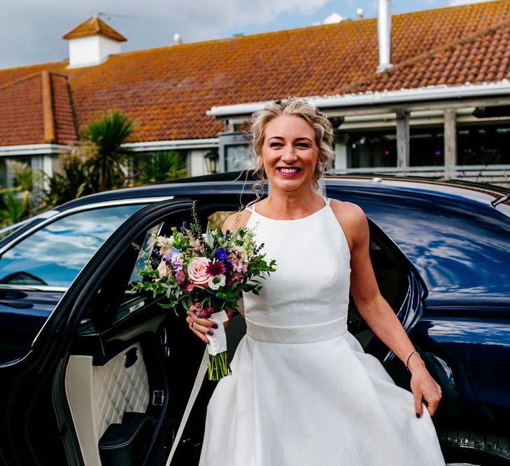 Bridal Entrance in Jesus Peiro Wedding Dress | Colourful Coastal Wedding at The Gallivant in Camber Sands with DIY Decor | Epic Love Story Photography