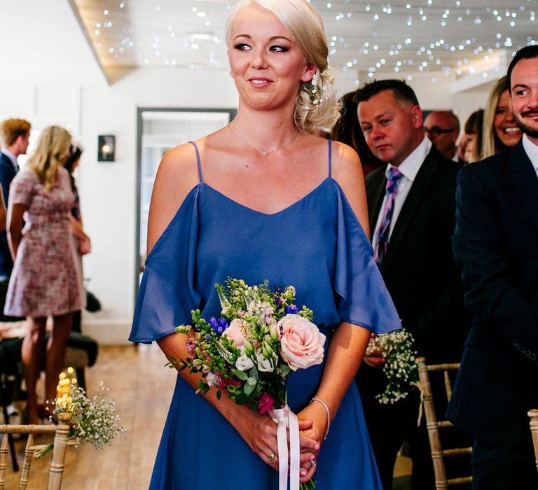 Bridesmaid in Blue ReWritten Cold Shoulder Dress | Colourful Coastal Wedding at The Gallivant in Camber Sands with DIY Decor | Epic Love Story Photography