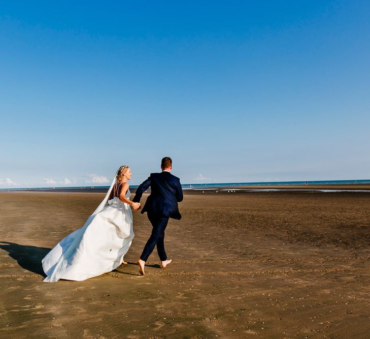 Beach Portrait | Bride in Jesus Peiro Gown | Groom in Navy Ted Baker Suit | Colourful Coastal Wedding at The Gallivant in Camber Sands with DIY Decor | Epic Love Story Photography