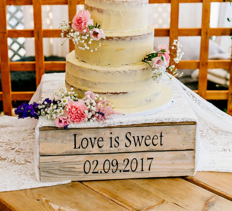 Homemade Wedding Cake on Personalised Wooden Crate Cake Stand | Colourful Coastal Wedding at The Gallivant in Camber Sands with DIY Decor | Epic Love Story Photography