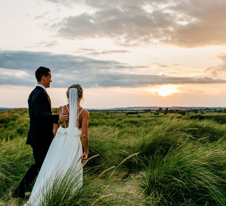 Beach Portrait | Bride in Jesus Peiro Gown | Groom in Navy Ted Baker Suit | Colourful Coastal Wedding at The Gallivant in Camber Sands with DIY Decor | Epic Love Story Photography