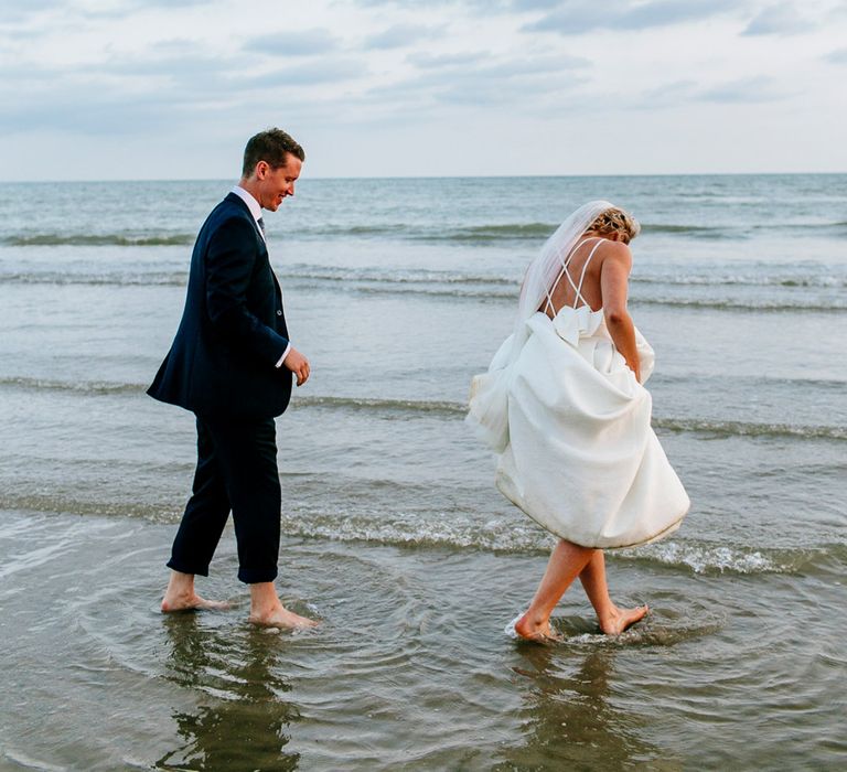 Beach Portrait | Bride in Jesus Peiro Gown | Groom in Navy Ted Baker Suit | Colourful Coastal Wedding at The Gallivant in Camber Sands with DIY Decor | Epic Love Story Photography