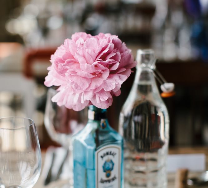 Coral Flower Stem in Gin Bottle | Bright Wedding at The Oyster Shed in London | Chris Barber Photography