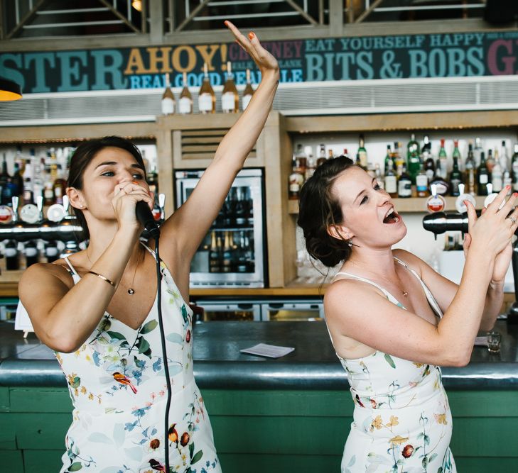 Bridesmaids in Floral Oasis Dresses | Bright Wedding at The Oyster Shed in London | Chris Barber Photography