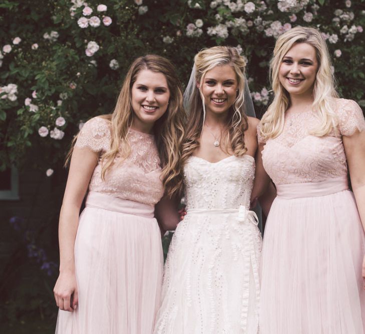 Bride in Monique Lhuillier Candy Wedding Dress & Bridesmaids in Pink BHLDN Dresses