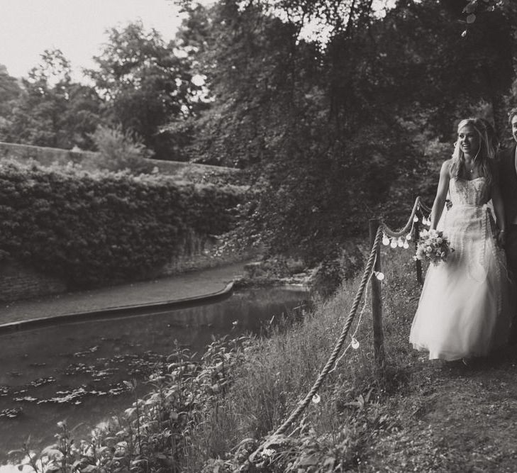 Bride in Monique Lhuillier Candy Wedding Dress & Groom in Traditional Tails