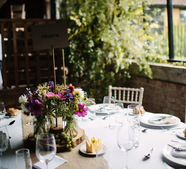 Rustic Tree Slab & Flowers in Jars Table Centrepieces