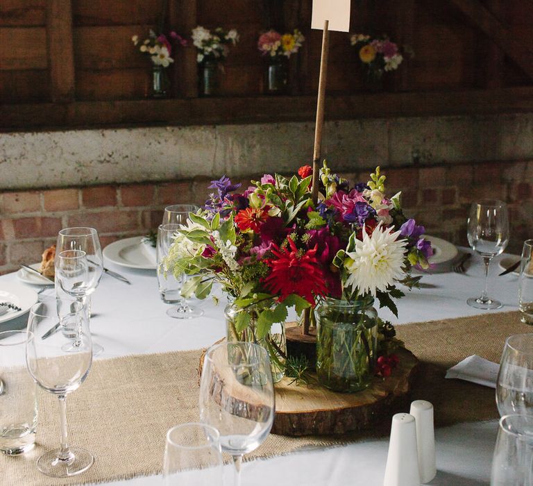 Rustic Tree Slice & Flowers in Jars Centrepiece