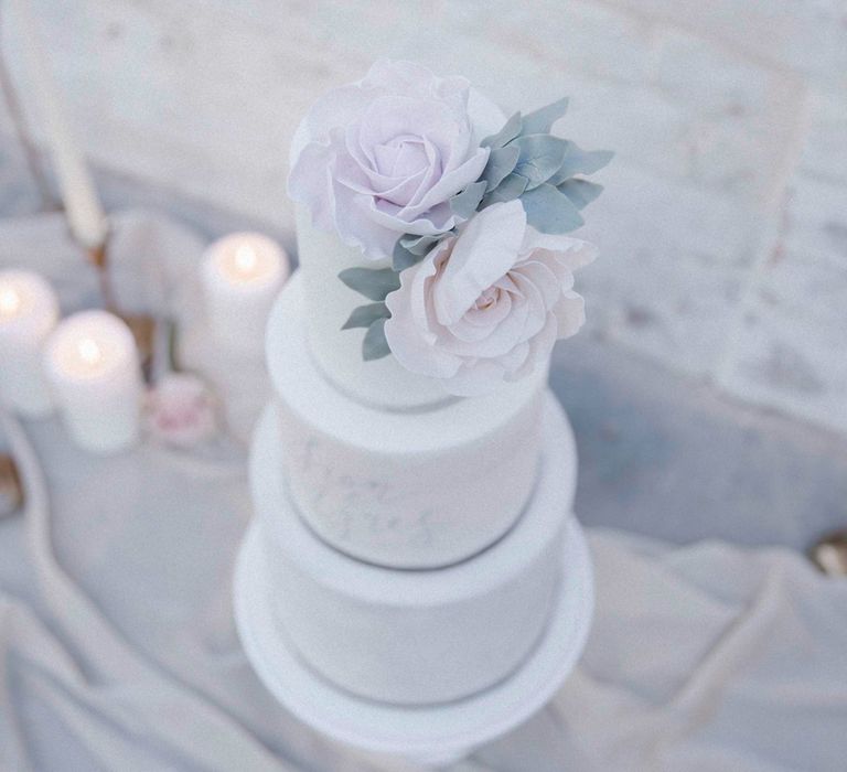 White Wedding Cake With Pale Pink Icing