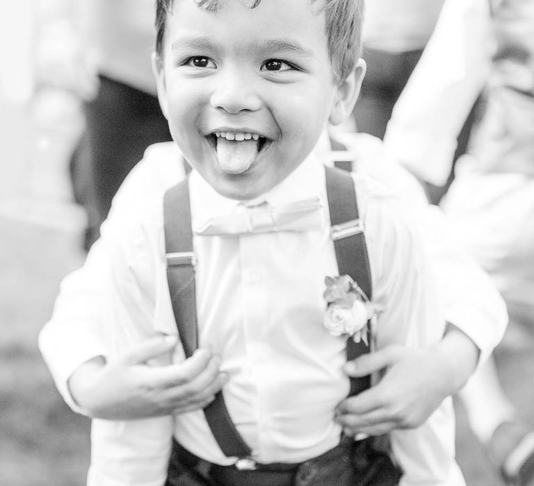 Page Boy in Bow Tie & Braces | Elegant Pastel Wedding at Gaynes Park, Essex | White Stag Wedding Photography | At Motion Film