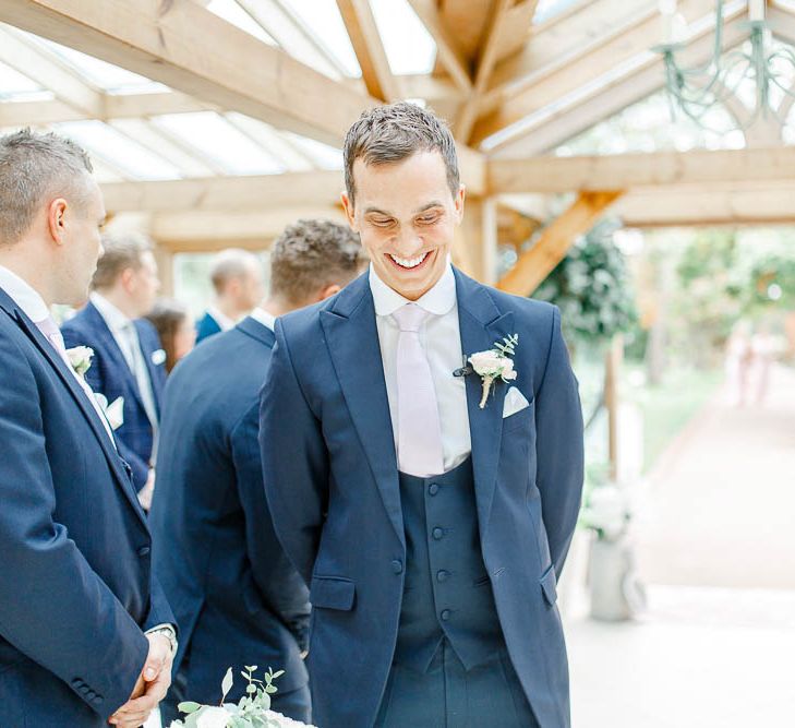 Groom at the Altar in Next Blue Suit at the Altar | Elegant Pastel Wedding at Gaynes Park, Essex | White Stag Wedding Photography | At Motion Film