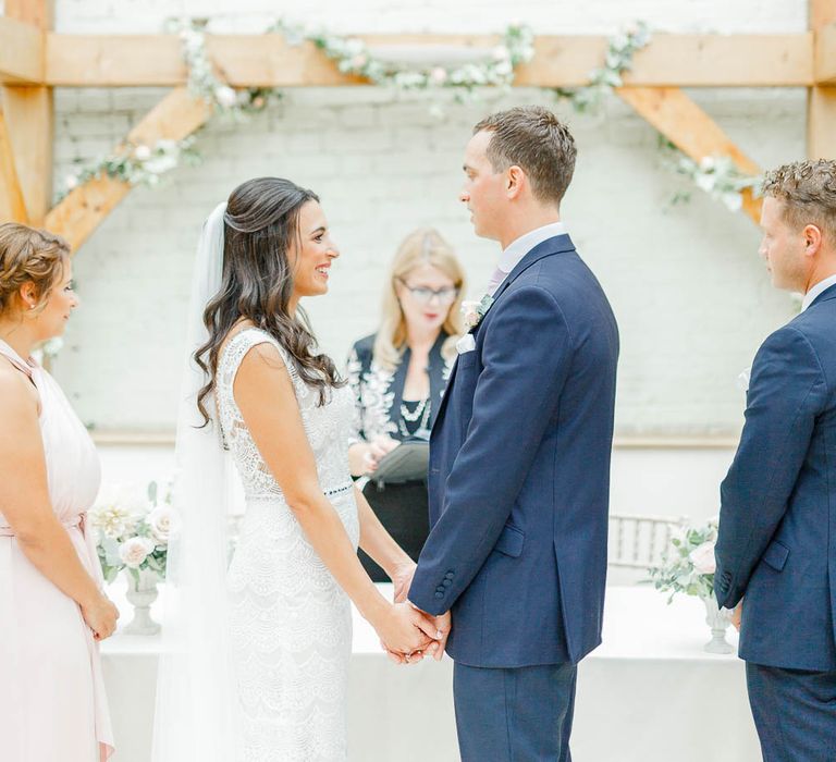 Wedding Ceremony | Bride in Lace Gown from Blackburn Bridal | Groom in Navy Three-piece Suit | Elegant Pastel Wedding at Gaynes Park, Essex | White Stag Wedding Photography | At Motion Film