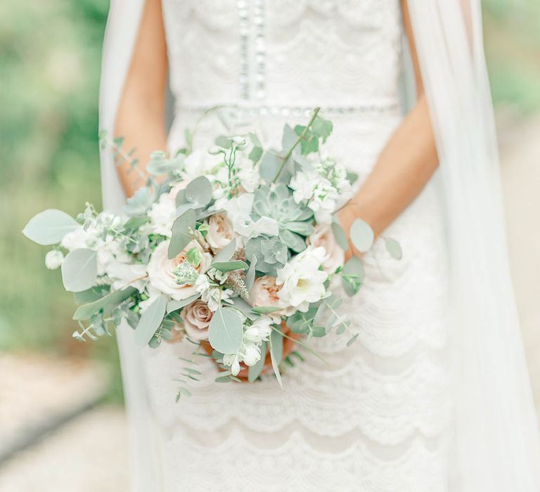 Bride in Lace Gown from Blackburn Bridal | Delicate Bouquet | Elegant Pastel Wedding at Gaynes Park, Essex | White Stag Wedding Photography | At Motion Film